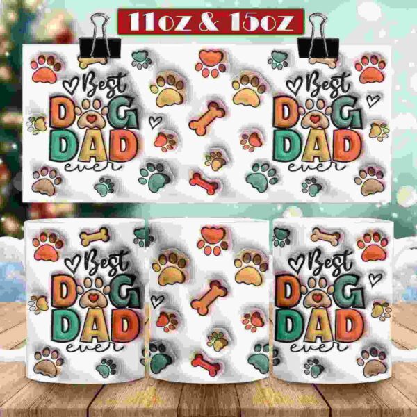 Mugs with "Best Dog Dad Ever" text and paw and bone illustrations are displayed on a wooden surface with a snowy, festive background. Available in 11oz and 15oz sizes.