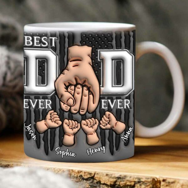 A white mug with "BEST DAD EVER" text, featuring a large hand tightly holding four smaller hands, with names Jason, Sophia, Henry, and Anna below each small hand. The background has a striped and stars pattern.