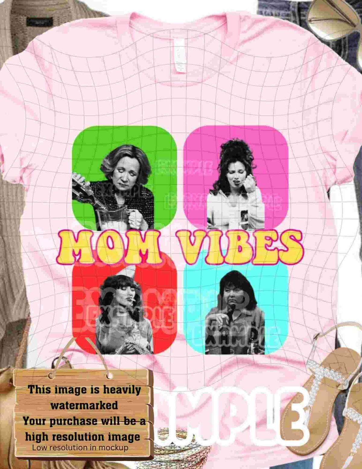 A pink T-shirt is displayed with colorful panels showing four black-and-white images of women. The text "MOM VIBES" is prominently featured in yellow with a red outline. The background includes various accessories, such as shoes and a bag.