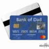 Two credit cards, one black and white and one blue labeled "Bank of Dad" with a card number, "Credit Card" text, "CARDHOLDER SINCE 2017," and "EXPIRATION DATE NEVER" with a MasterCard logo.