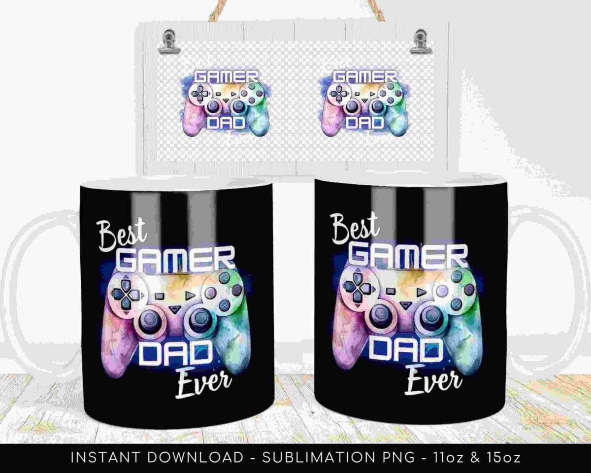 Two coffee mugs with the text "Best Gamer Dad Ever" and a graphic of a game controller. The mugs are displayed on a light wood surface with a similar graphic image shown above them.