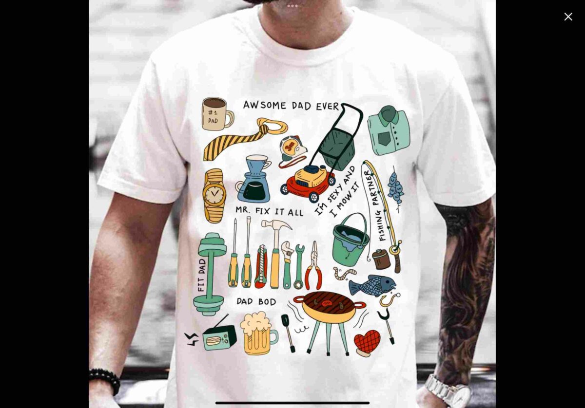 Alt Text: Man wearing a white T-shirt featuring various colorful illustrations and text related to dads, including tools, a grill, a mug, a tie, and captions like "Awesome Dad Ever" and "Mr. Fix it All.