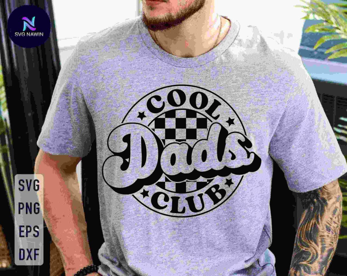 Man wearing a grey t-shirt with a "Cool Dads Club" logo featuring a checkered pattern in the background.