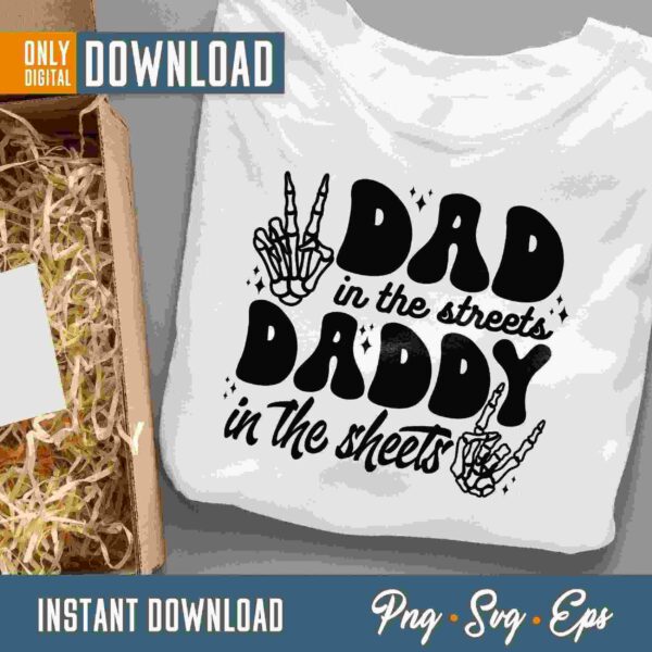 A white t-shirt with black text "Dad in the streets, Daddy in the sheets" displayed alongside packaging materials. The image also mentions instant digital download in PNG, SVG, and EPS formats.