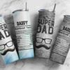 Four travel tumblers are displayed on a marble surface. Each tumbler has a "Super Dad" design with nutritional facts and a mustache graphic.