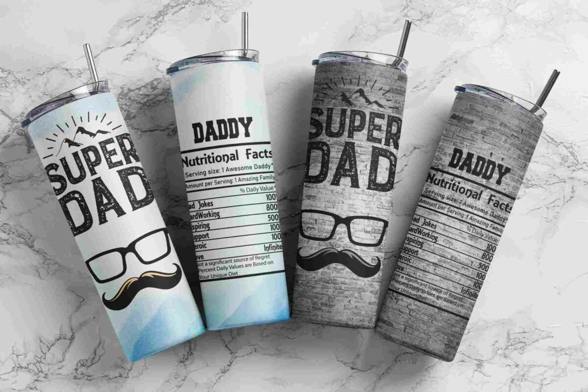 Four travel tumblers are displayed on a marble surface. Each tumbler has a "Super Dad" design with nutritional facts and a mustache graphic.