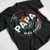 Black t-shirt with a circular logo featuring an eagle and cactus. Text reads "El Papá Más Chingón" in Spanish, meaning "The Coolest Dad." The logo's colors are green, white, and red.