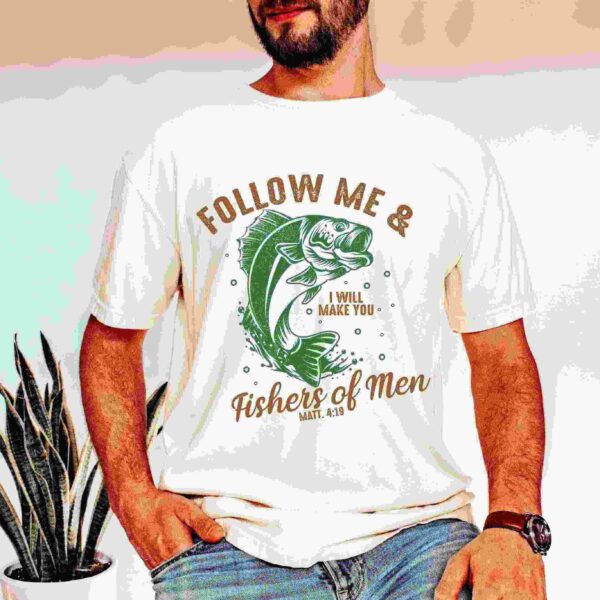 A man stands wearing a t-shirt with the text "Follow Me & I Will Make You Fishers of Men, Matt. 4:19" and a fish graphic.