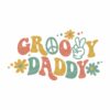 A colorful retro design with the text "Groovy Daddy." The word "Groovy" is in orange and yellow, with a peace sign replacing the "O." The word "Daddy" is in green, and a hand making a peace sign is included. Surrounding the text are yellow and blue flowers with green leaves.