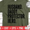 A green T-shirt with black text that reads: "Husband. Daddy. Protector. Hero." The image also includes a label for digital download and file formats: SVG, DXF, EPS, PNG.