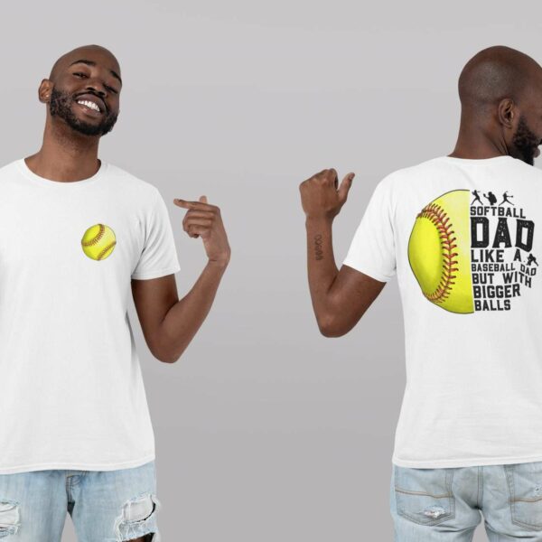 A man wearing a white T-shirt is shown from the front and back. The front of the shirt features a yellow softball graphic. The back of the shirt displays the text, "Softball dad. Like a baseball dad but with bigger balls," accompanied by a softball graphic.