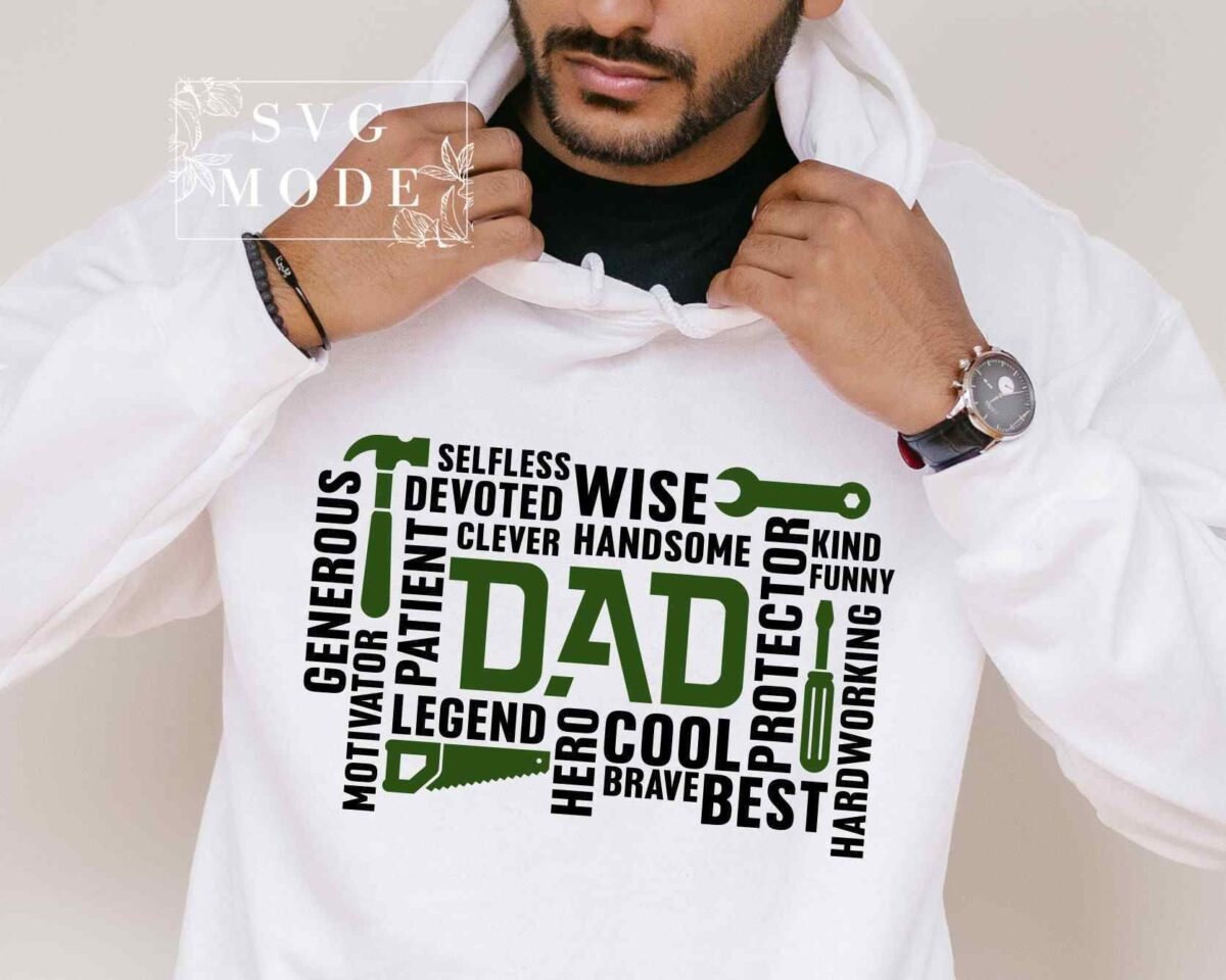 A person wearing a white hoodie with a word cloud design centered around the word "DAD" featuring adjectives like wise, cool, hardworking, and protector.