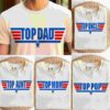A white T-shirt worn by a person, with "Top Dad" written in red and blue text. Four other T-shirts are shown with similar designs, labeled "Top Uncle," "Top Aunt," "Top Mom," and "Top Pop.