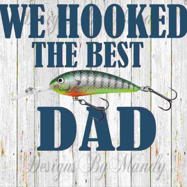 A wooden background with text "WE HOOKED THE BEST DAD" and an image of a fishing lure in the center.