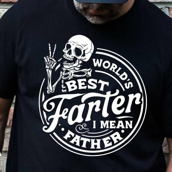 A person wearing a black T-shirt with a design of a skeleton holding up two fingers. The text on the shirt reads, "World's Best Farter I Mean Father.
