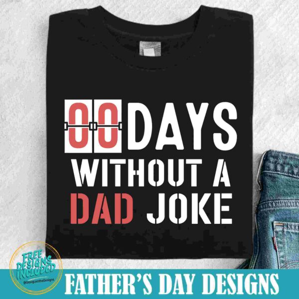 A black t-shirt with the text "00 Days Without A Dad Joke" in white and red lettering. The shirt is displayed on a white surface next to a pair of blue jeans. "Father's Day Designs" is mentioned at the bottom.